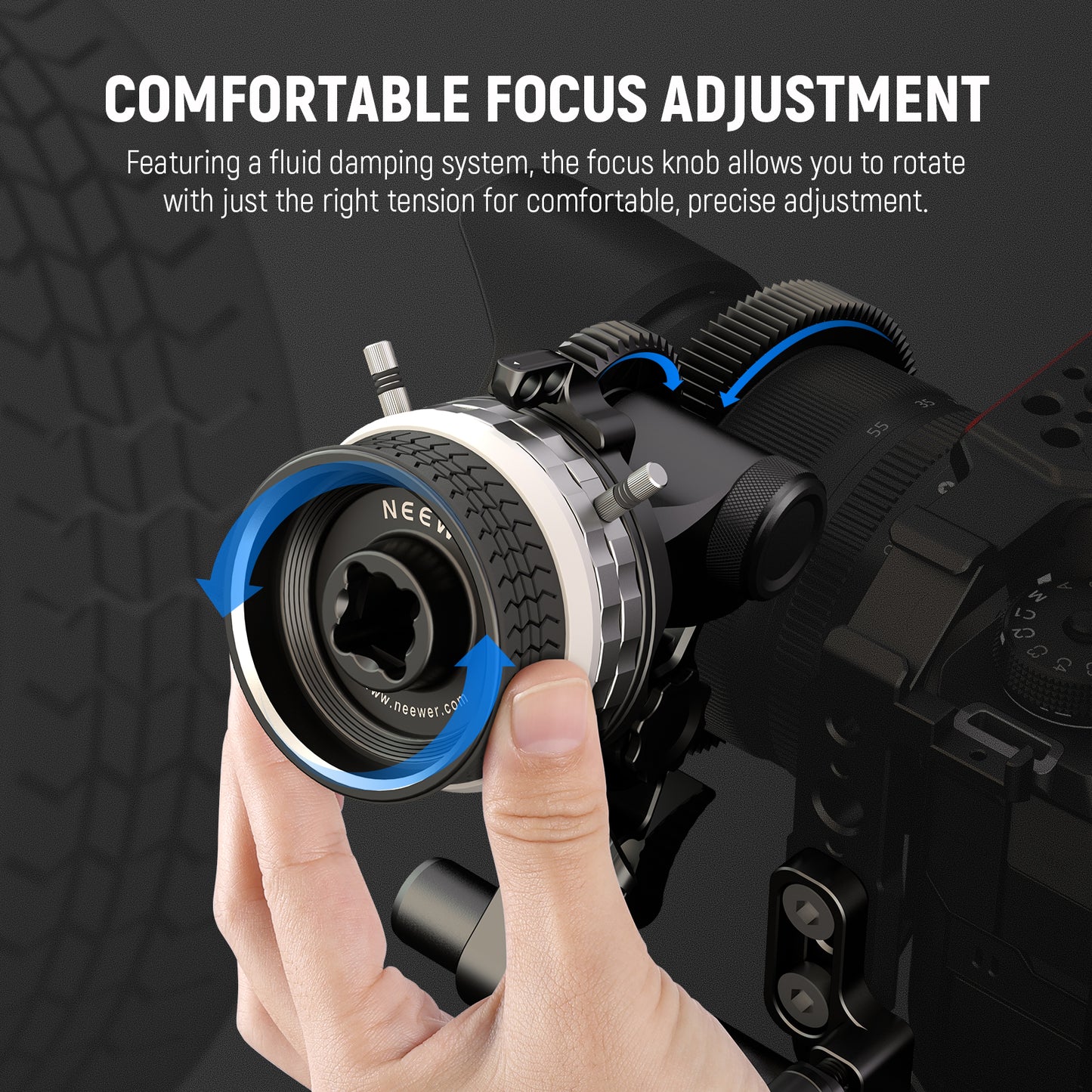 Camera lens with focus knob being adjusted by a hand on a dark background
