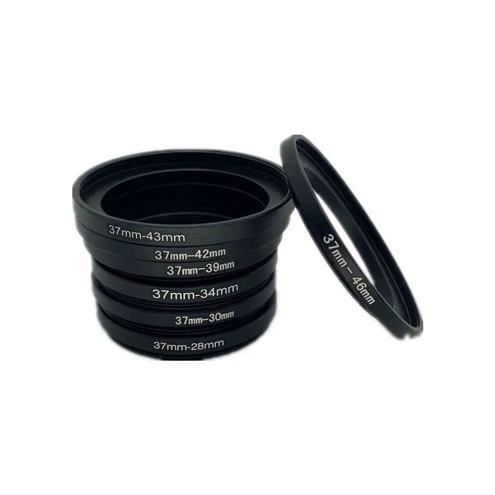 37mm adapter rings 37-43, 37-42, 37-39, 37-34, 37-30 and 37-28mm stacked next to a 37-46mm ring