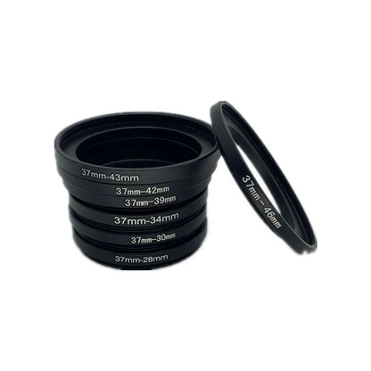 37mm adapter rings 37-43, 37-42, 37-39, 37-34, 37-30 and 37-28mm stacked next to a 37-46mm ring